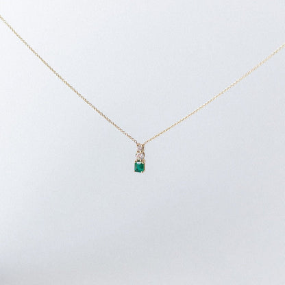 EMERALD AND DIAMONDS MOUNTED IN 14K YELLOW GOLD